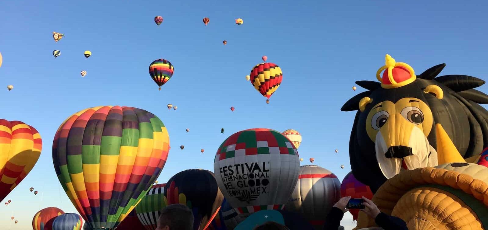 a group of hot air balloons in the sky from Favorite New Mexico Fall Events & Festivals Worth the Trip on Slow Down, See More from New Mexico Calendar of Events, Fairs & Festivals: Fall on Slow Down, See More